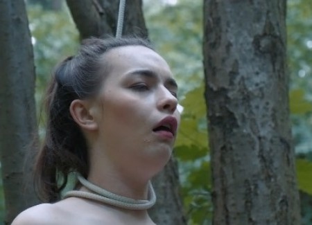 JOGGER GIRL HANGED - The lonely jogger girl is walking alone in the forest. She thinks nobody is here and she decides to have a sunbath nude. But maniac stalks her, attacks, chokes her from behind and handed on the tree